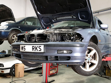 BMW 328i with headlights removed